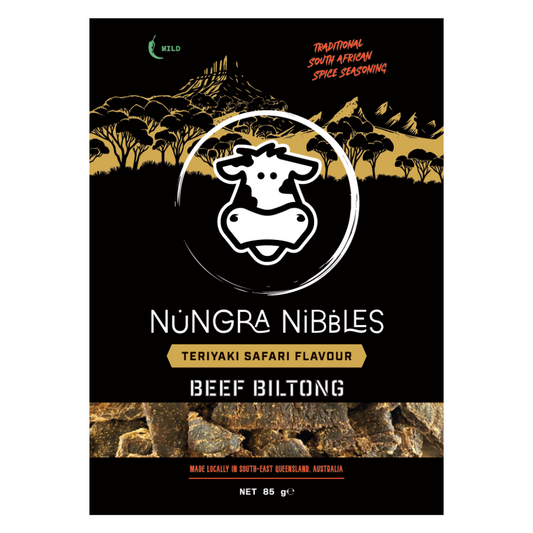 Packaging of Nungra Nibbles Safari Biltong with Teriyaki Flavour. The bag is predominantly black with gold and white text and graphics, including a cow's head logo.