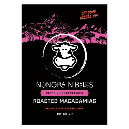 Nungra Nibbles salt & vinegar flavour roasted macadamias packaging with a cow illustration on a black background.