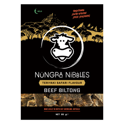 Packaging of Nungra Nibbles Safari Biltong with Teriyaki Flavour. The bag is predominantly black with gold and white text and graphics, including a cow's head logo.