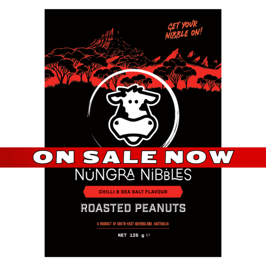 Nungra Nibbles roasted peanuts packaging with a cow logo on a black background